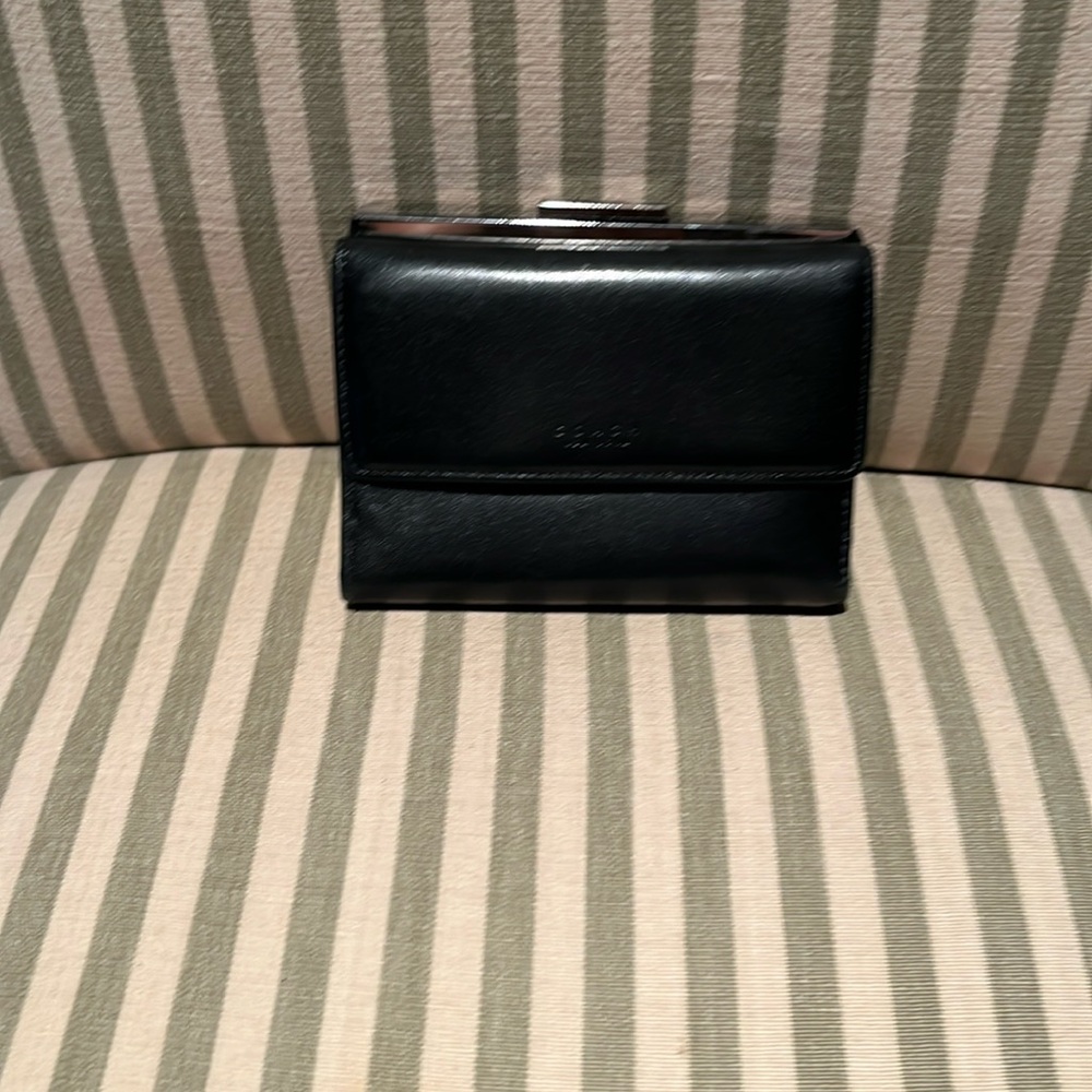 Coach black vintage wallet with some wear.